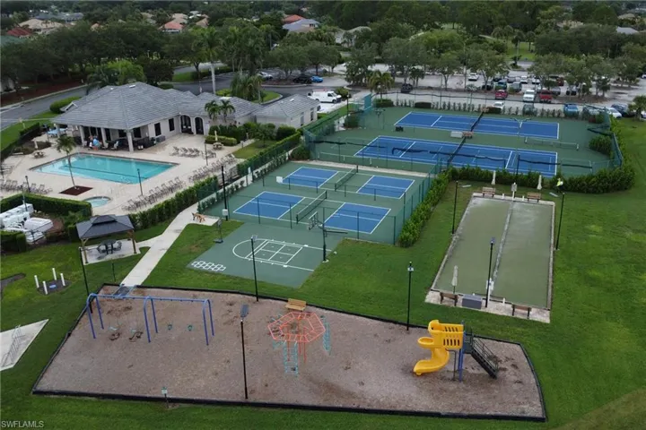 Aerial view of a pool area and a park