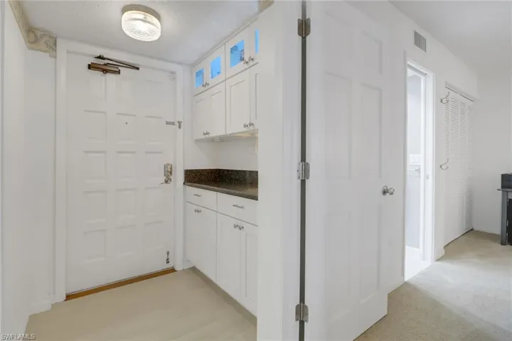 Front door with built in cabinets