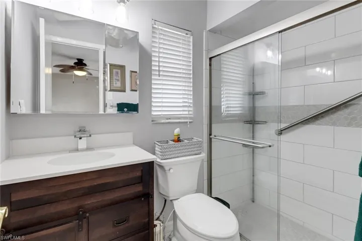 Bathroom featuring vanity and walk in shower