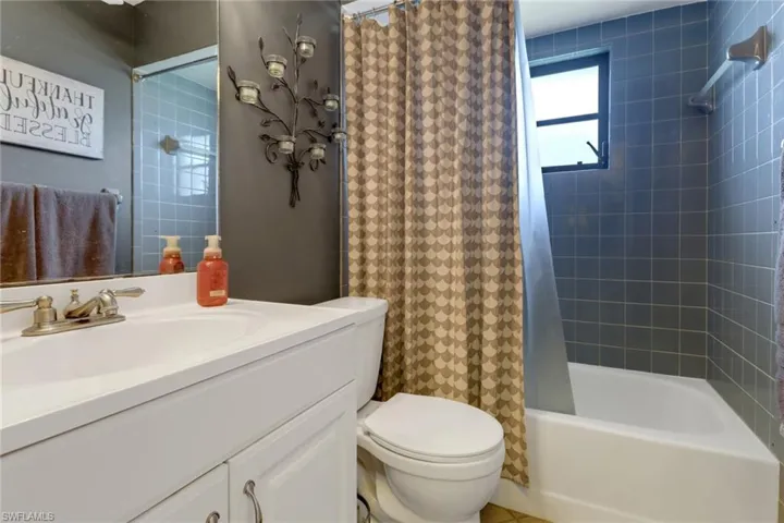 Full bathroom with vanity, and shower / bath combination