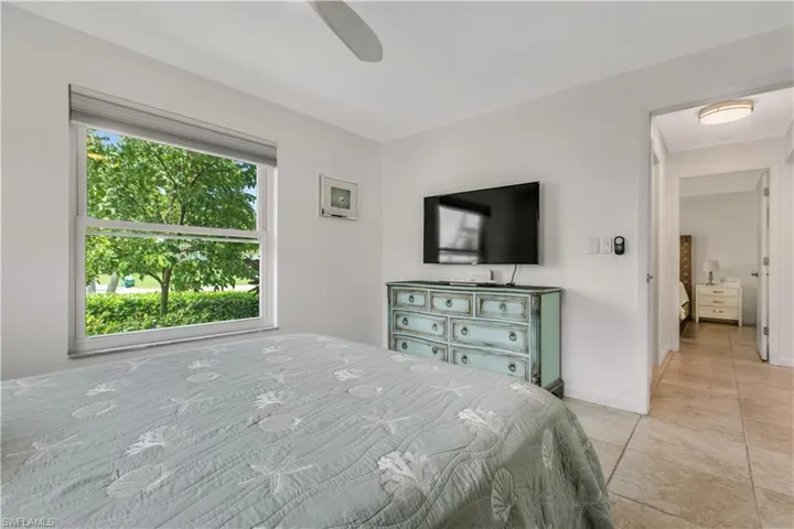 Tiled bedroom with ceiling fan