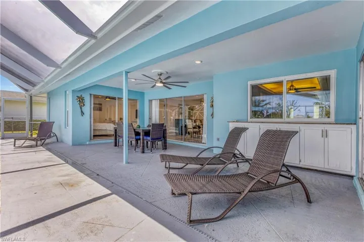 View of patio featuring ceiling fan