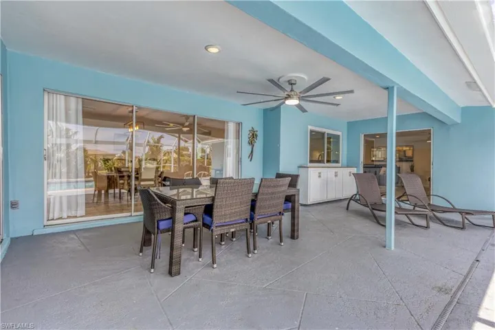 Dining room featuring ceiling fan and beam ceiling