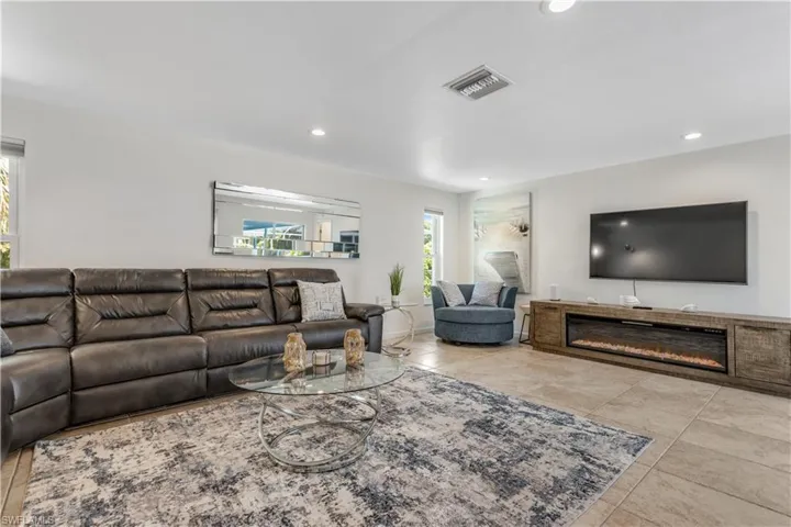 Living room with light tile patterned floors