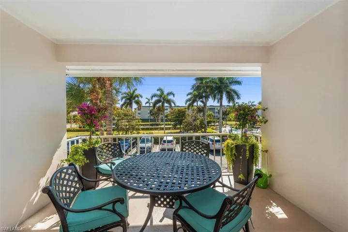Balcony with outdoor dining space - facing community center and amenities