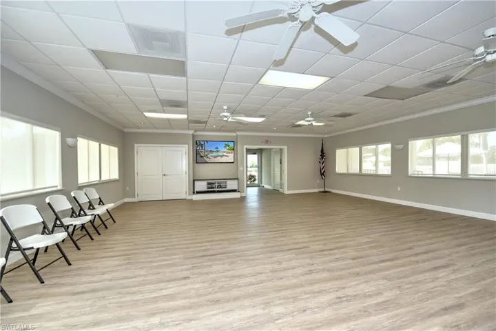 Recreation Hall featuring light vinyl floors, ceiling fan and kitchen facilities. Can be booked for private gatherings