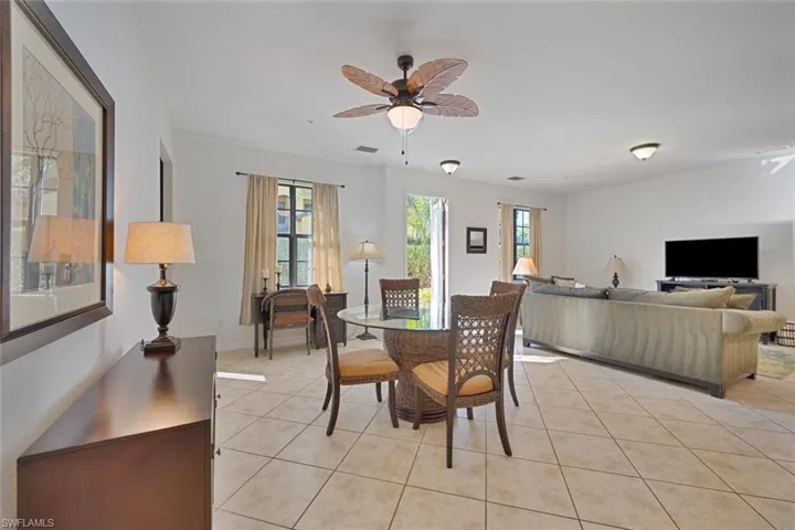 Dining room featuring ceiling fan and light tile patterned floors