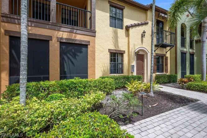 View of exterior entry featuring stucco siding