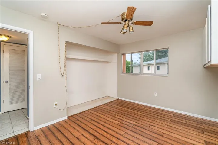 Unfurnished bedroom featuring a closet, ceiling fan, and tile floors