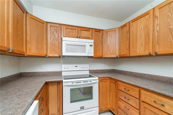 Kitchen featuring white appliances