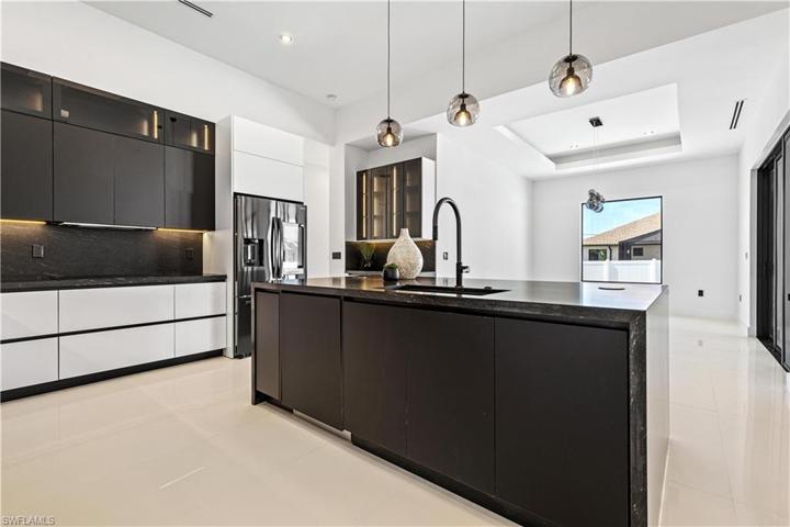 Kitchen - Cooktop with Black Glass, Large Farmhouse Sink with Chrome Faucet