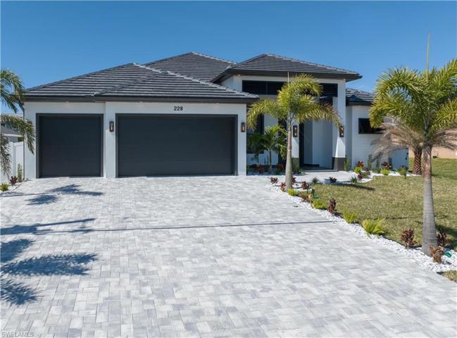 Front View - Concrete Paver Driveway, 3-Car Garage