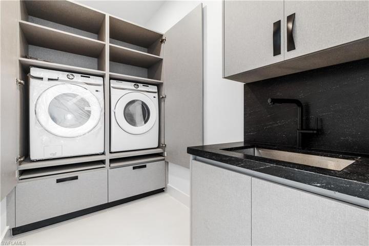 Laundry - Custom Cabinetry for SAMSUNG Washer & Dryer with a LOT of space for STORAGE and drawer for FOLDING!