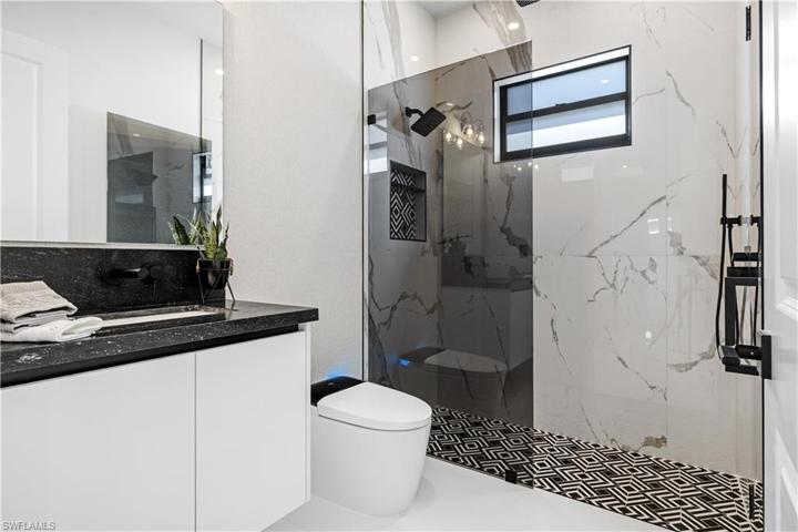 Hallway Bathroom 3 - Quartz Countertop, Wall Mounted Faucet, Eletric Toilet, Tiled Shower, Rain & Hand Shower Heads (Multi-Function), Marble & Porcelain Tiled Flooring