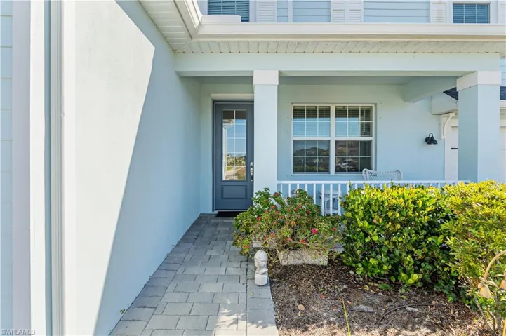 Doorway to property with covered porch
