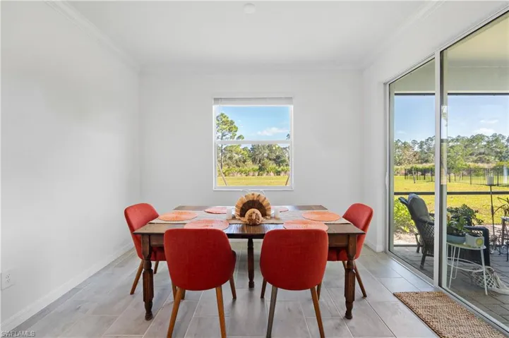 Dining space featuring crown molding