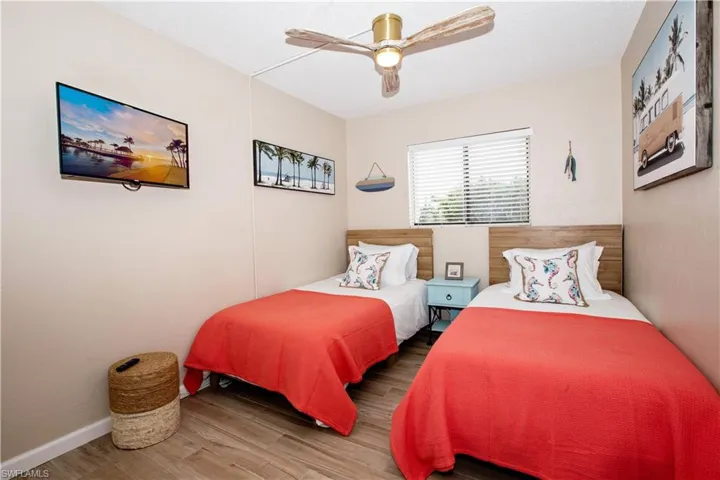 Bedroom with wood-type flooring and ceiling fan