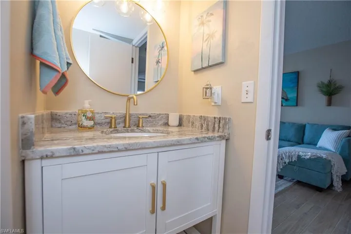 Bathroom with hardwood / wood-style flooring and vanity