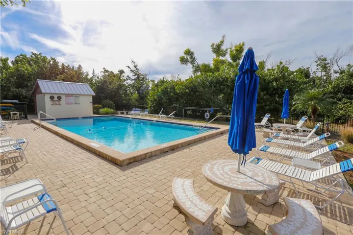 View of pool featuring a patio and an outdoor structure