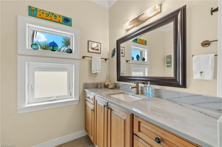 Bathroom featuring tile patterned floors and vanity