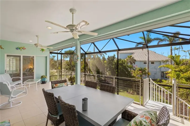 Sunroom featuring ceiling fan