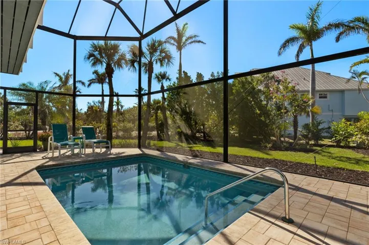 View of pool featuring a lanai and a patio area