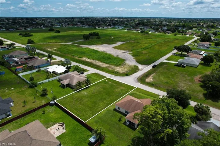 Aerial view of residential area with property boundaries highlighted