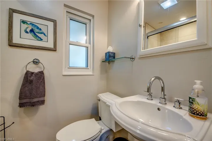 Bathroom featuring a sink and an enclosed shower