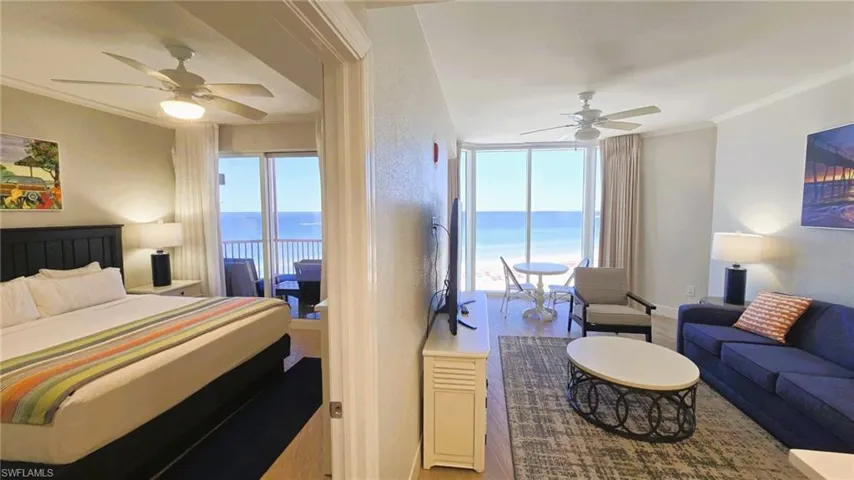 Bedroom featuring crown molding, ceiling fan, light wood-style floors, and access to outside