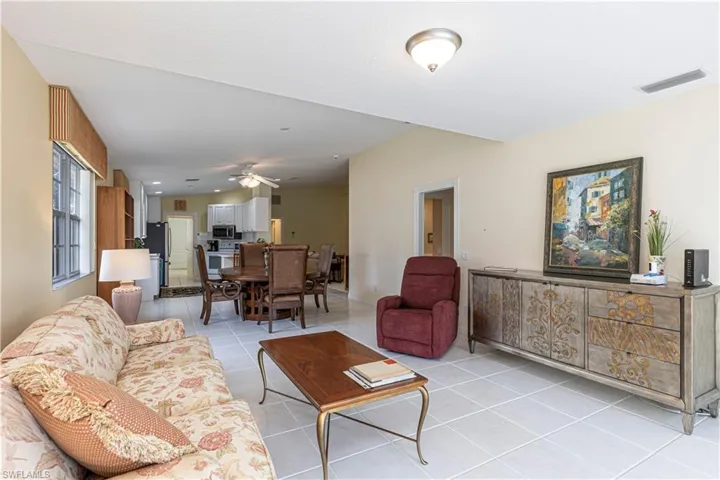 Living room featuring ceiling fan and light tile patterned flooring