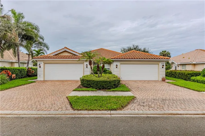 Mediterranean / spanish-style home featuring a garage