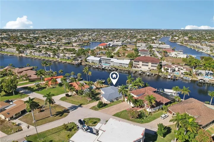 Aerial view of residential area with a nearby body of water