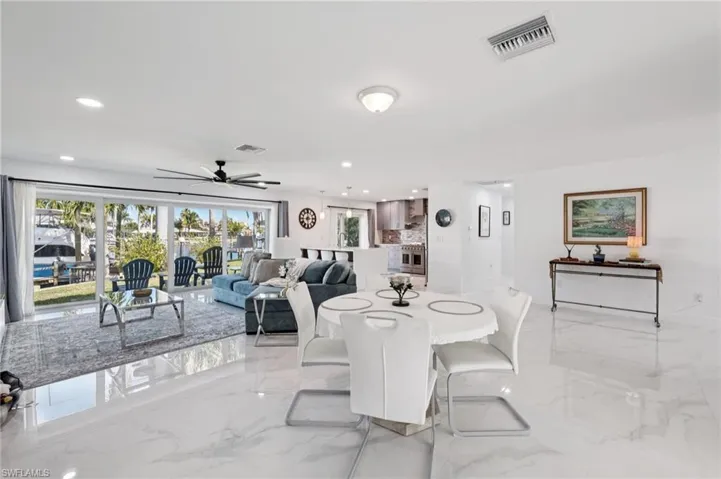 Dining room featuring recessed lighting, light marble finish flooring, and ceiling fan
