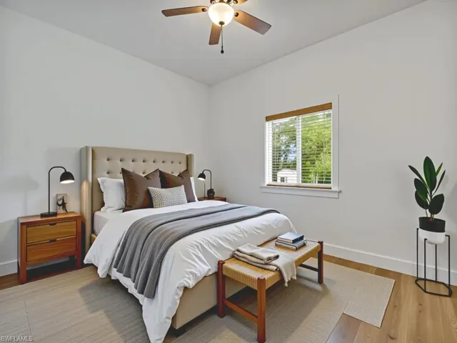 Bedroom featuring light wood-style flooring and ceiling fan