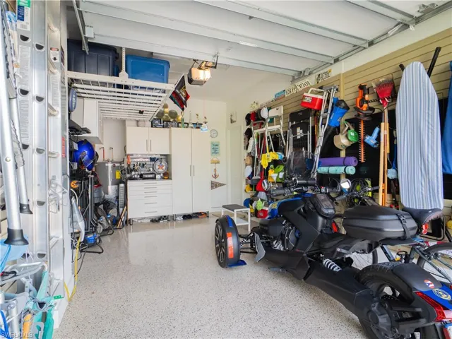 Garage with a garage door opener and electric water heater