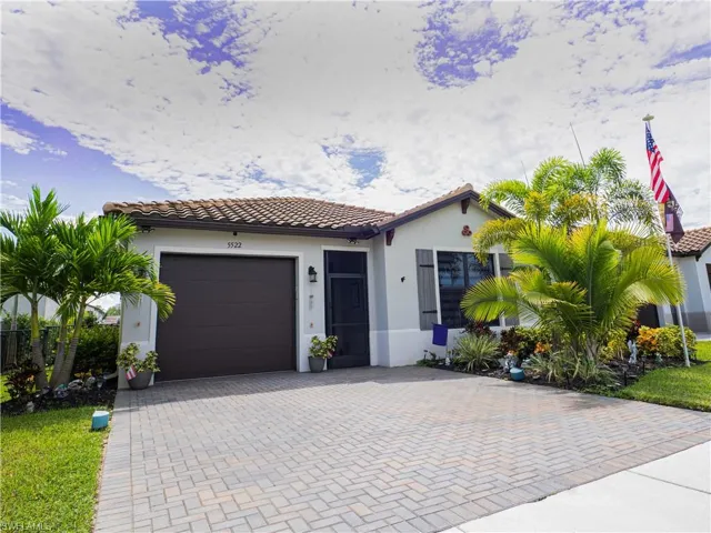 Mediterranean / spanish-style house with a garage