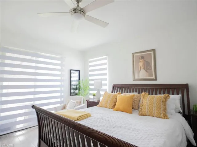 Bedroom featuring ceiling fan and light hardwood / wood-style floors