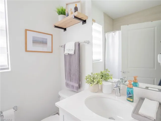 Bathroom with vanity and toilet