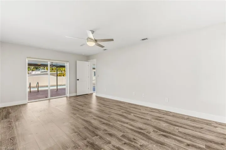 Primary Suite with Pool Access ~ Impact Windows/Doors Throughout
