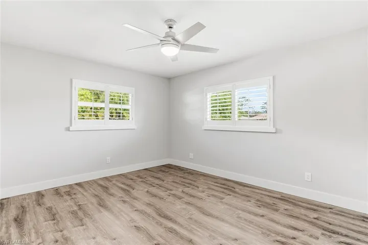 Guest Bedroom 1 ~ Plantation Shutters/Impact Glass