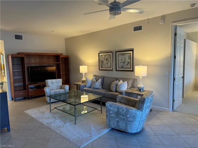 Living area featuring beautiful furniture which includes TV and ceiling fan