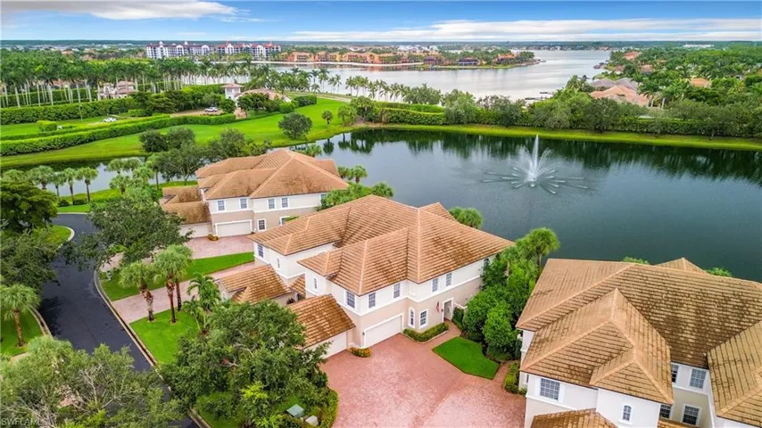 Birds eye view of property with a water view.  This community has been freshly painted with all new roofs.