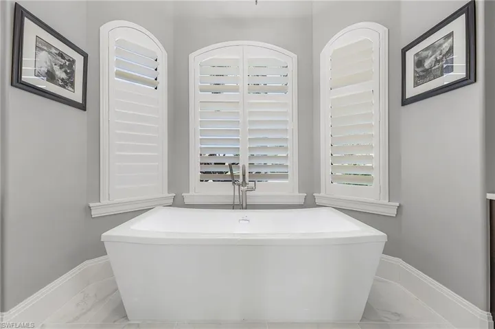 Bathroom featuring a tub to relax in