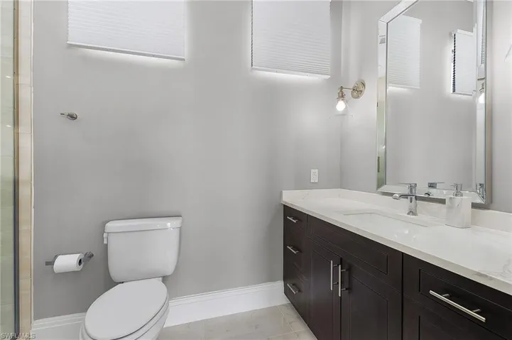 Bathroom with vanity and toilet