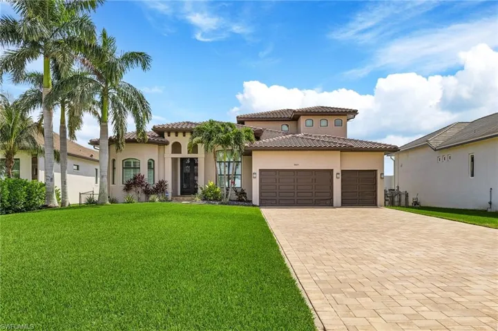 Mediterranean / spanish-style home featuring a garage and a front yard