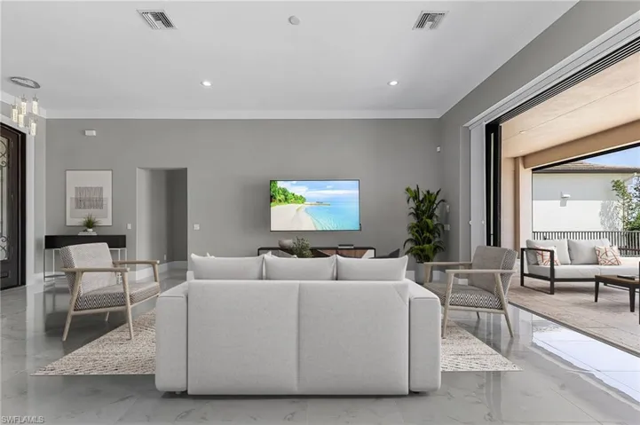 Living room featuring ornamental molding