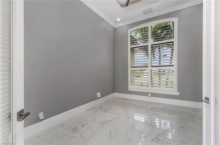 Unfurnished room featuring ornamental molding