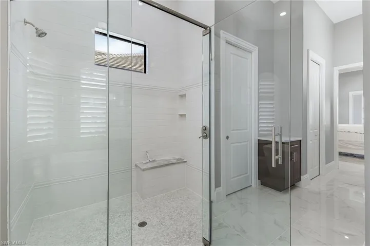 Bathroom with a shower with door