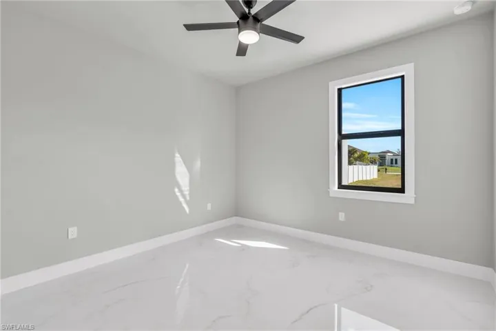 Unfurnished room featuring ceiling fan