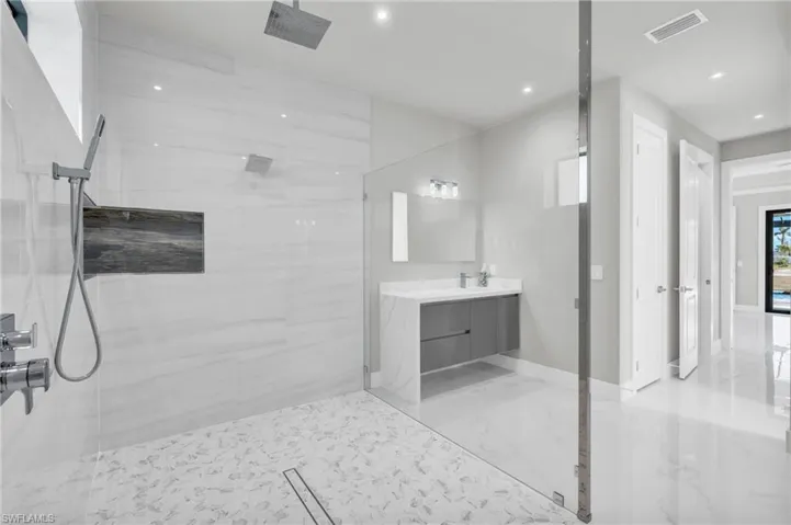 Bathroom featuring vanity and walk in shower